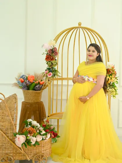 A series of portraits showcasing this beautiful mom-to-be in a vibrant yellow gown. Each shot captures a slightly different angle and smile in our classic studio.