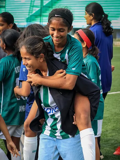 Pure joy and camaraderie. Two of our U13 girls celebrate their first-ever title win, a moment that shows the strong bonds formed through competition.