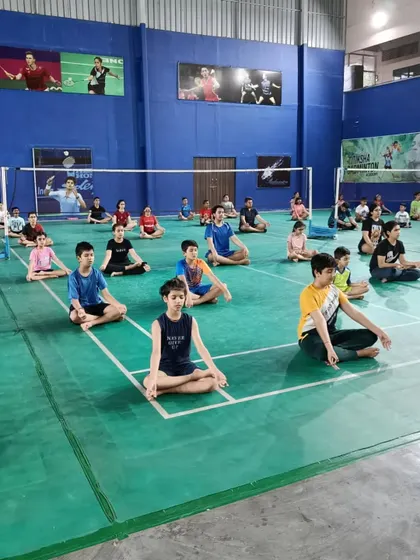 A group of my students in a yoga session, learning to connect with their breath and body. This practice is vital for developing body awareness, balance, and mobility.