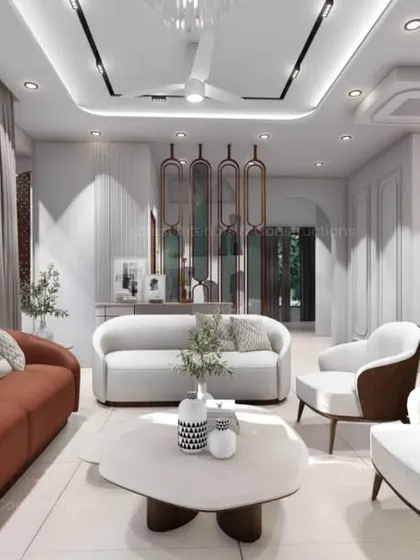 A wider angle of the living space, showing the arrangement of the rust-colored sofa and white accent chairs around an organic-shaped coffee table. The design prioritizes comfort and a relaxed, luxurious feel.
