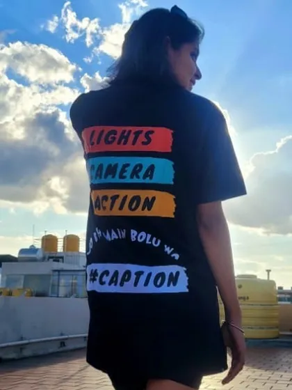 Another angle of the Bawaal Trend tee, with the sky as a backdrop. The graphic on the back makes a bold statement, which is a key part of this street-style look.