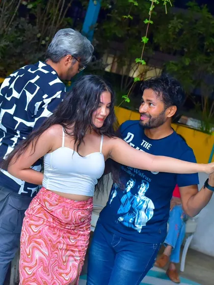A fun and energetic couple on the dance floor.