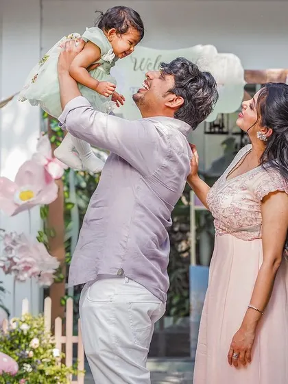 A heartwarming family photo capturing a moment of pure joy. The beautiful decor serves as the perfect backdrop for these priceless memories.