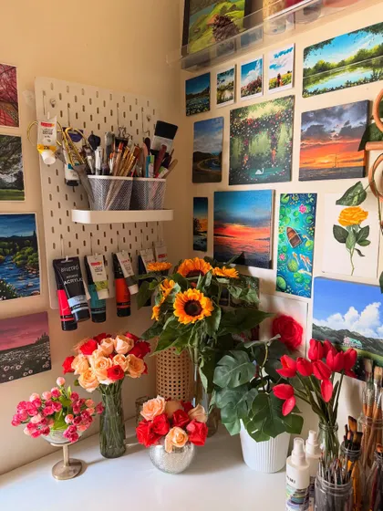 Good things take time. A corner of my studio filled with fresh flowers and my paintings. The bright colors always make me feel inspired.