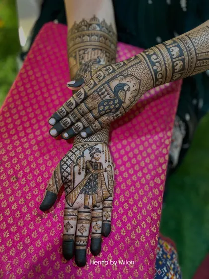 A unique bridal design where one hand features a groom portrait and the other showcases a majestic peacock, symbolizing grace and beauty.