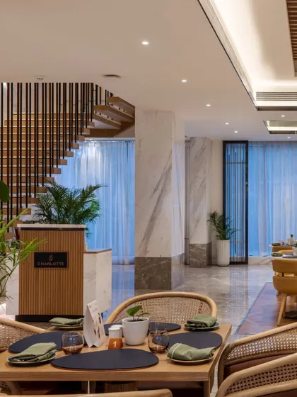 Additional views of the Radisson Resort, Khopoli, showcasing various interior and exterior details, from lobby seating areas and restaurant layouts to guest room configurations and architectural elements.