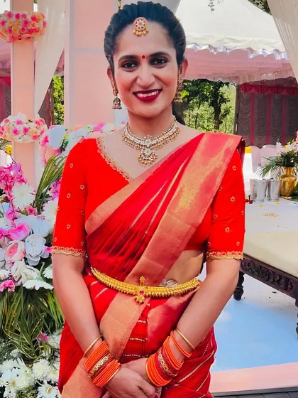 A close-up of Sahana's radiant look in her red Navratri saree. Her festive spirit is as beautiful as her smile.