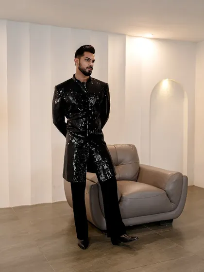 This image captures the essence of our evening collection. The black sequined jacket is for the modern man who makes bold choices and values individualistic style.