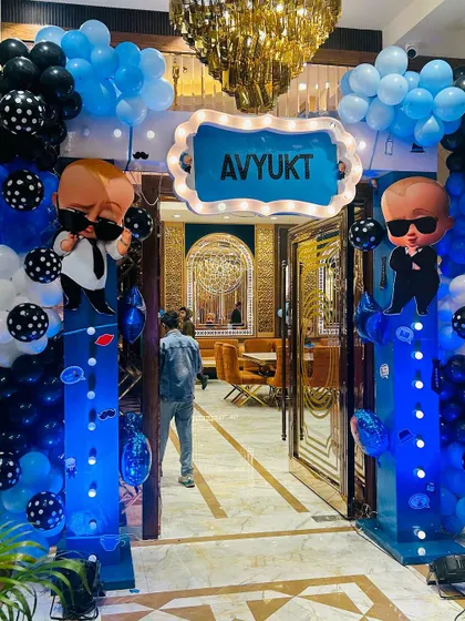 A grand and immersive entrance for a Boss Baby themed party. The lighted columns and character cutouts create an exciting entryway for guests.