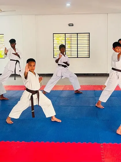 A student demonstrates his form during the black belt grading exam.