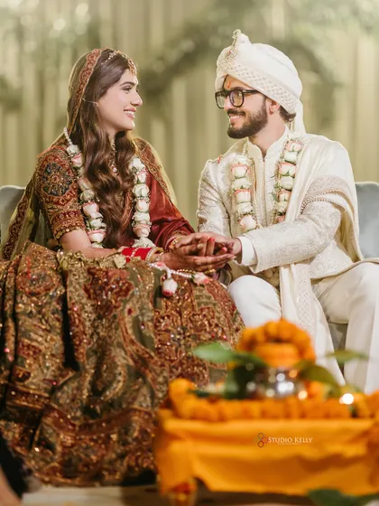 A sweet, candid moment of the couple sharing a look during their wedding ceremony.