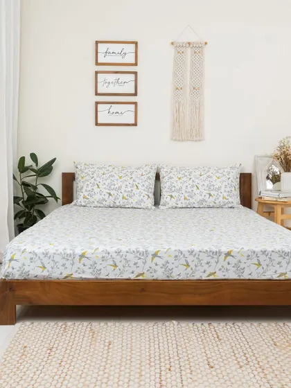 Our 'Winged Skies' bedsheet brings a light and airy feel to this minimalist bedroom. Made from soft, breathable cotton, it's the perfect foundation for a comfortable and stylish bed.