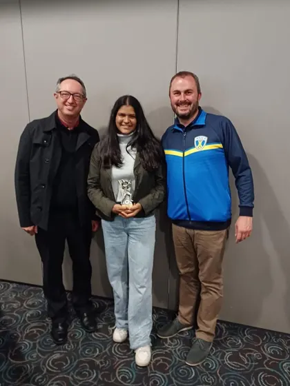 Arya Khadilkar receiving her award in Australia. She was the highest scorer in a tournament featuring eight regional teams from across the state of Victoria.