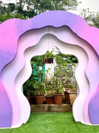 This layered wavy abstract panel creates a stunning visual effect with its ombre purple and pink tones. It serves as a beautiful and modern photo backdrop, perfect for birthdays, showers, or corporate events.