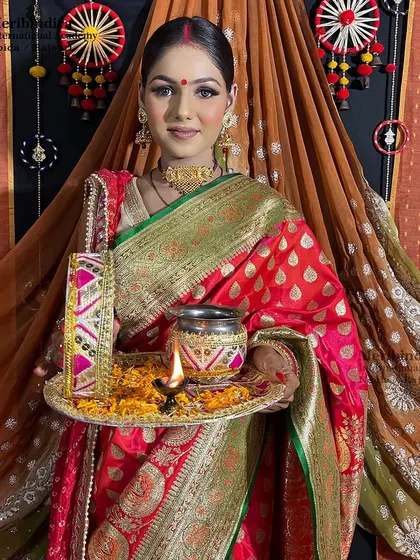The complete Karwa Chauth look, featuring a classic bun hairstyle that is perfect for holding a dupatta and showing off jewelry.