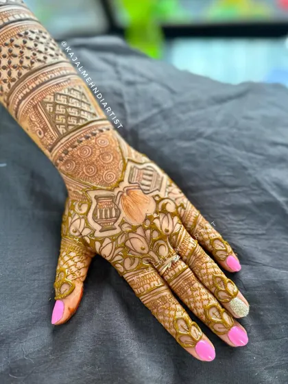 A special henna design for a Tapasvi. This piece is filled with auspicious symbols like the kalash and swastika, created with reverence for their spiritual journey.