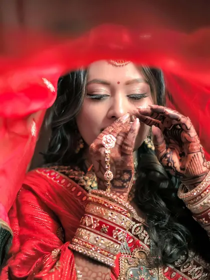 A quiet moment before she walks down the aisle. This artistic shot captures the soft, breathable phera look I created for Nehal. The focus is on her enhanced features and glowing skin, a timeless and minimal wedding makeup style that looks incredible under any light.