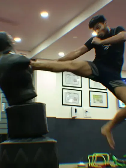The follow-through of a flying kick shows the full extension and impact. We teach you to master your body and push your physical limits.