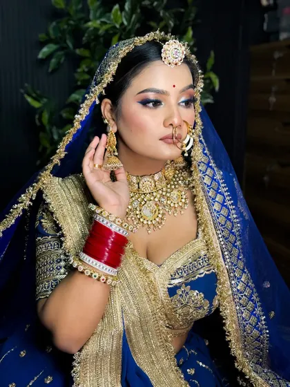 A beautiful portrait of the Rajputi bride, highlighting her stunning jewelry and the intricate details of her makeup.