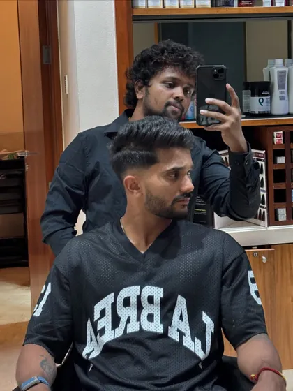 A fresh haircut for the rising star Nitish Kumar Reddy of Sunrisers Hyderabad. This style features a sharp fade and textured top.