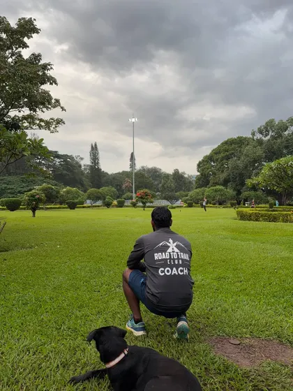 A quiet moment with Batman, looking out over the green expanse of Cubbon Park.