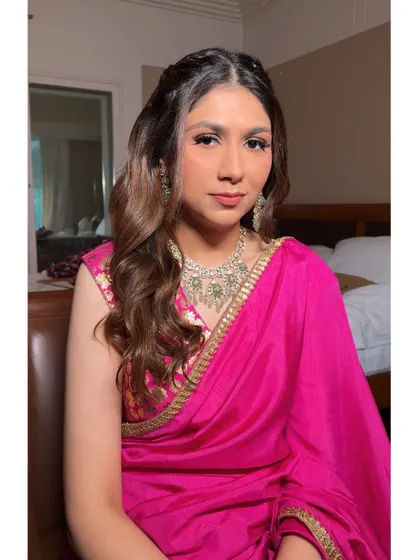 A perfect soft glam look for a bridesmaid or wedding guest. The makeup is polished and pretty, with a focus on defined eyes and a neutral pink lip.