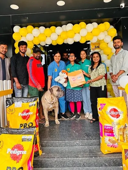 More happy faces from our successful campaign. Our team and customers gather with their pets, surrounded by bags of Pedigree food, celebrating a great day at the store.