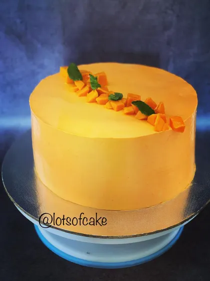 When mangoes are in season, my fresh mango cake is a must-try. It features a smooth mango-flavoured frosting and is topped with fresh, diced mangoes and mint leaves for a light and fruity dessert.