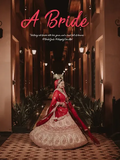 A breathtaking full-length portrait of the bride in a grand corridor. This shot highlights the magnificent trail of her lehenga and makes her look like a true princess walking towards her destiny.