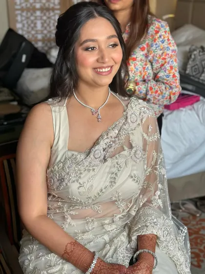 A happy, smiling bride at her Roka. The makeup is light and fresh, perfect for this special pre-wedding celebration.