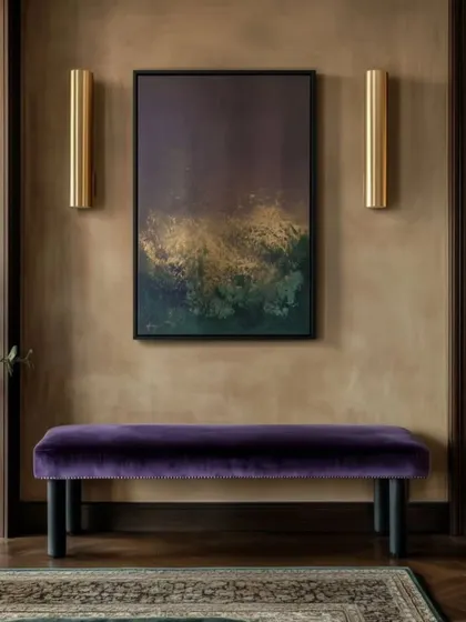 This abstract painting with deep purple and gold tones adds a touch of understated luxury to this hallway. We curate pieces that complement your interior design, creating a cohesive and sophisticated look throughout your home.