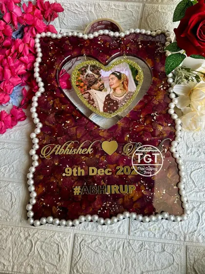 A full view of the frame, showcasing the couple's names and wedding hashtag, #ABHIRUP, in golden script.