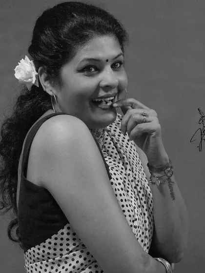 A happy, candid monochrome shot in a polka dot saree. A genuine smile is always the best accessory.