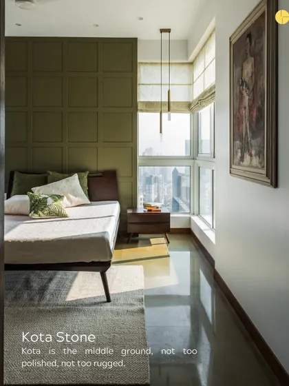 Kota stone is the middle ground, not too polished, not too rugged. Here, its smooth, cool surface provides a perfect floor for a sunlit bedroom, balancing the warmth of the wood and the olive green wall.