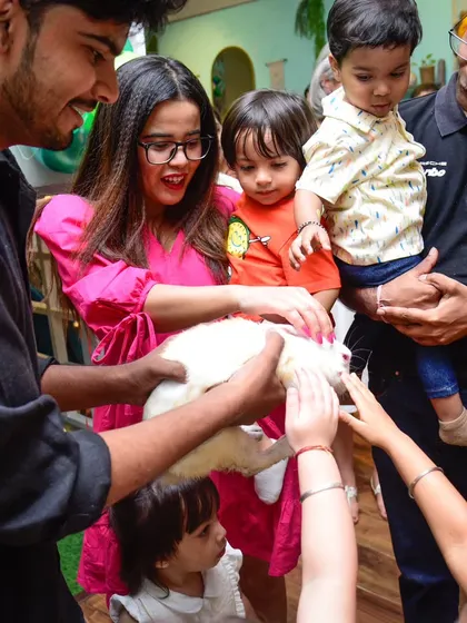 A magical moment as the kids get to meet and pet a real bunny during the magic show. Their gentle curiosity and excitement is wonderful to see.