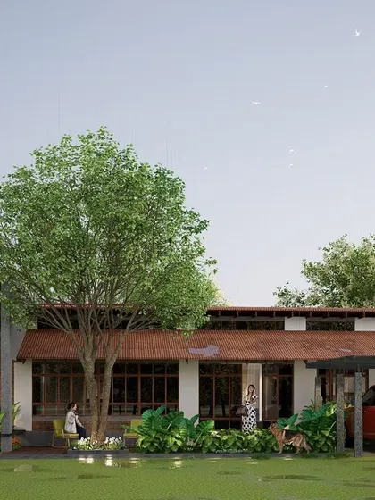 Set in the serene landscape of Kodagu, this eco-conscious retreat is designed for sustainable living. The single-story structure with its gently sloping roof and wide eaves sits lightly on the land, surrounded by existing trees to create a harmonious blend of modern living and nature.