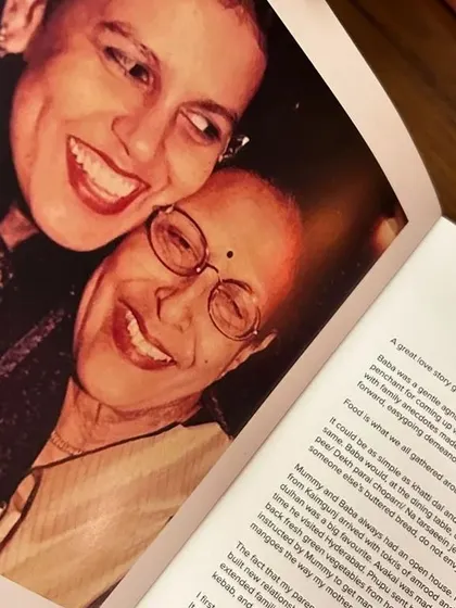 A beautiful photo from a client's bespoke cookbook, capturing a moment of joy between mother and daughter. These books are filled with love.