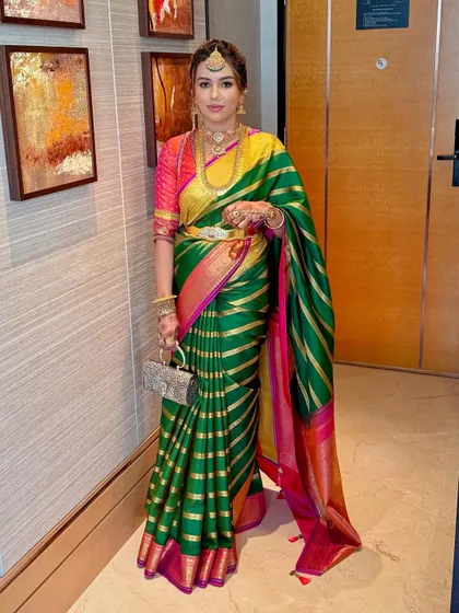 Deeksha's look is a masterclass in modern tradition, pairing a classic Kanjivaram with perfectly blended, contemporary makeup.