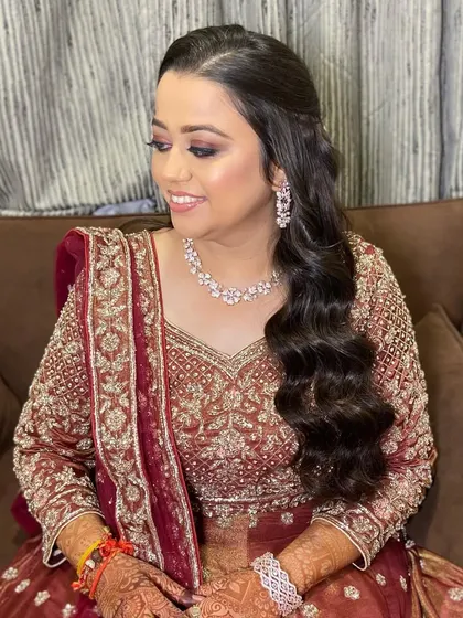 A soft and smiling portrait of my sangeet bride. The makeup is glamorous yet elegant, with a focus on beautifully defined eyes.