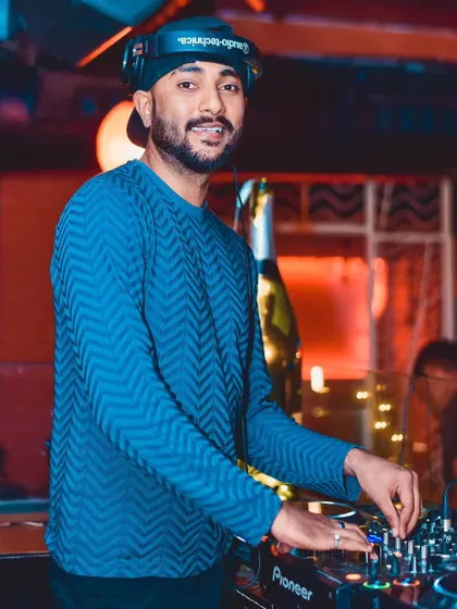 Mixing tracks under the club lights. My goal is to create a spiritual journey through music, lifting everyone's spirits and making sure you never want to leave the dance floor.