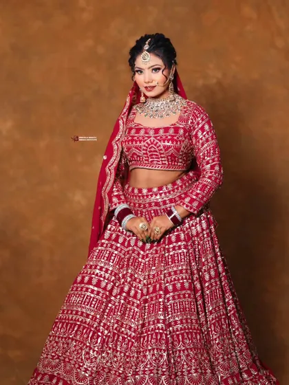 A confident pose from a stunning bride. The makeup is bold yet elegant, designed to empower you on your wedding day.