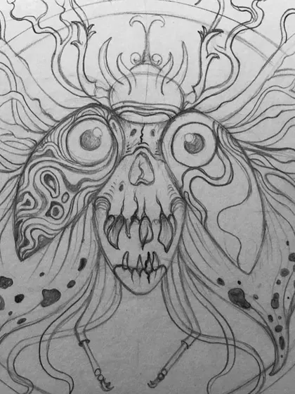 The pencil sketch for my surreal moth design. You can see the skull and wing shapes are defined before the detailed patterns are added.