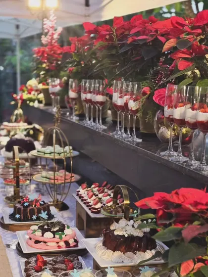 For a corporate Christmas event, I designed this lavish dessert table. The spread was decorated with festive poinsettia flowers and elegant tiered platters, creating a visually appealing and delicious experience for guests.