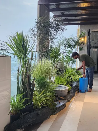 Our service doesn't end after installation. Our dedicated maintenance team provides regular care, like seen here in this balcony rock garden, to ensure your green space thrives.