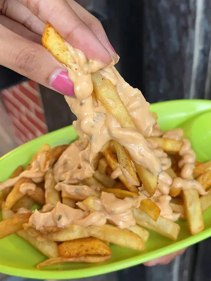 A bite of my Thousand Island Fries, showing the creamy and tangy dressing that makes them so special.