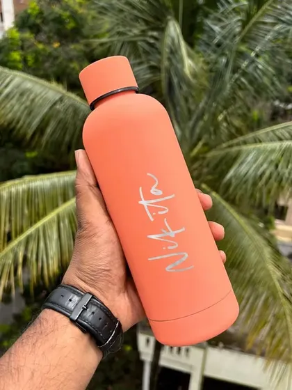 The Solid Flask in a cheerful orange color. All color options provide a great canvas for your custom name or logo.