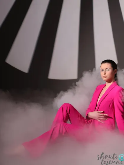 Another angle from the smoky Label.san shoot, with the model seated gracefully amidst the clouds of smoke.