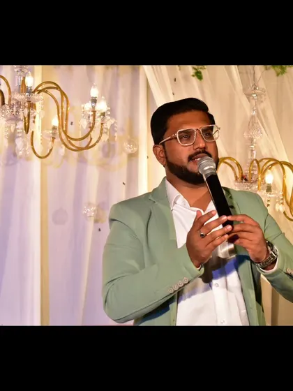 Expression is everything. A candid shot of me speaking at an engagement ceremony.
