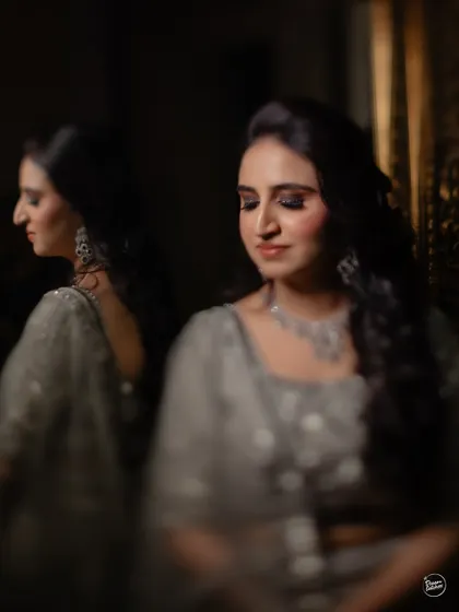 An elegant portrait of the bride before her ring ceremony, using reflections to create a soft, artistic, and introspective mood.