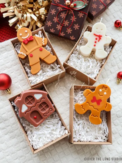 My gingerbread candle family, all boxed up and ready for gifting. The set includes different gingerbread man designs and a cute gingerbread house.